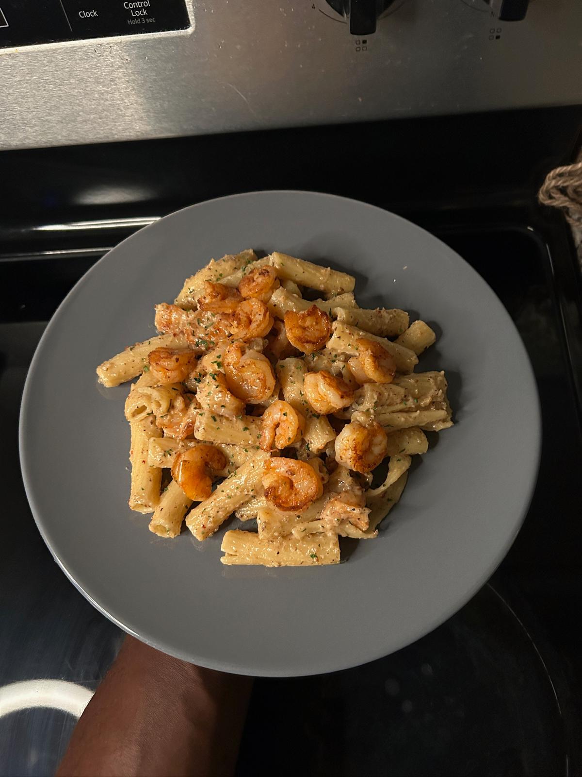 Creamy pasta with herbs and seasoned protein