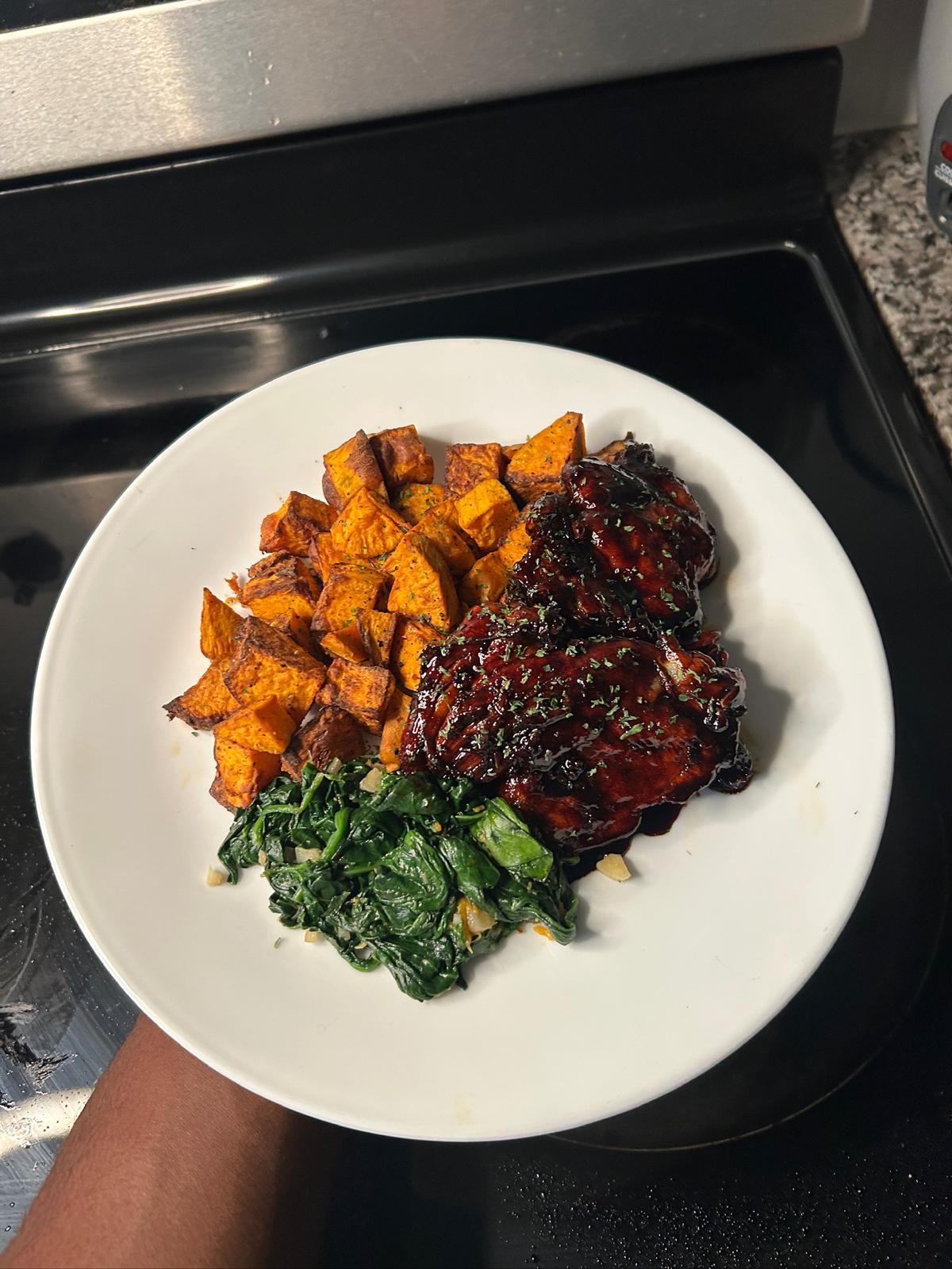 Mashed sweet potato with a dark-glazed protein portion
